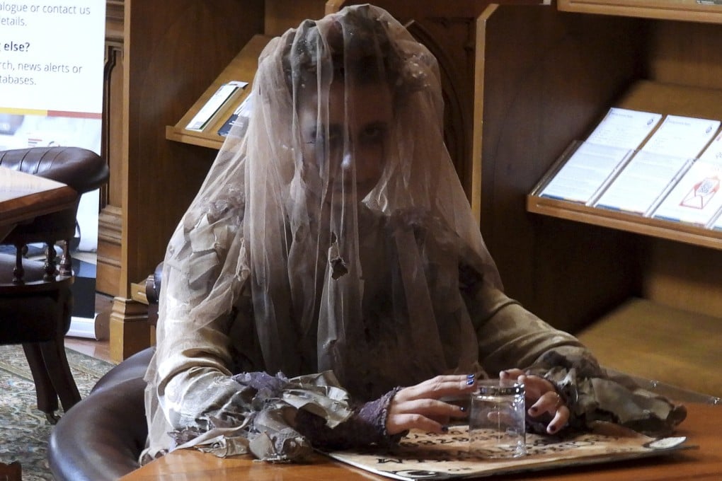 A tour guide retells the haunted history of New Zealand’s parliament library in Wellington on Thursday. Photo: AP