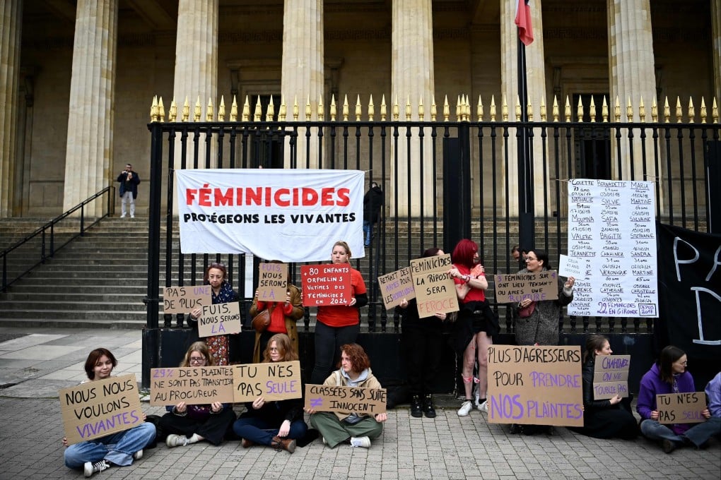 Protesters in front of Bordeaux court on Monday hold signs during a demonstration on the sidelines of the trial of Mounir Boutaa. Photo: AFP