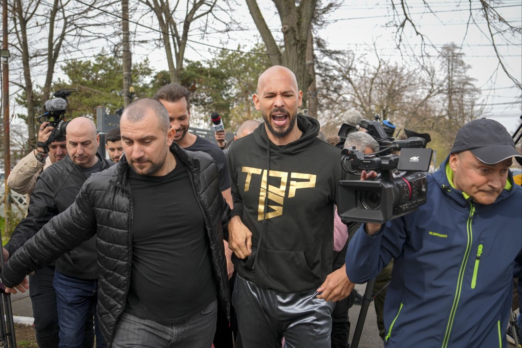 Andrew Tate after checking in at a police station in Voluntari, Romania. Photo: AP