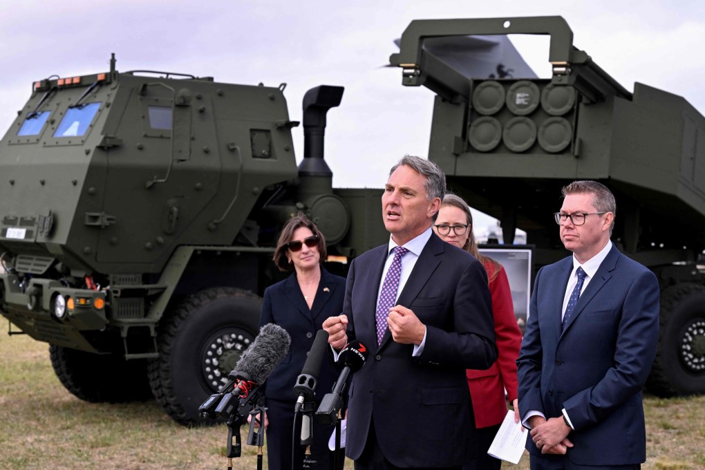 Australia’s Defence Minister Richard Marles (centre) and Defence Industry Minister Pat Conroy (right) announce the delivery of Australia’s first Himars launchers on Monday. Photo: AFP
