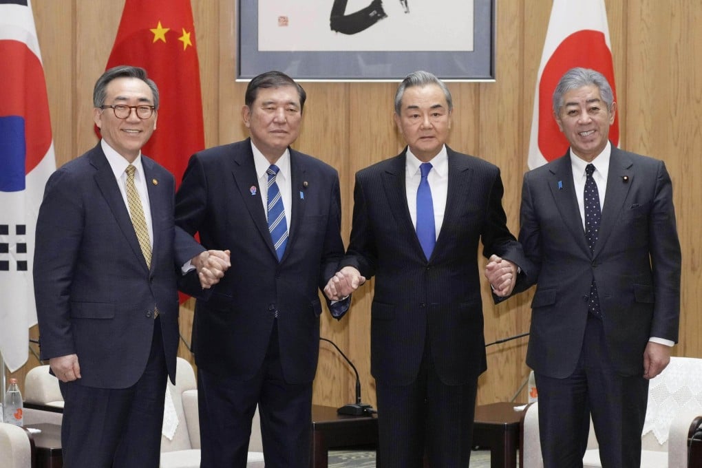 Japanese Prime Minister Shigeru Ishiba (second left) with foreign ministers (from left) Cho Tae-yul of South Korea, Wang Yi of China and Takeshi Iwaya of Japan, at Ishiba’s office in Tokyo on March 21. Photo: Kyodo