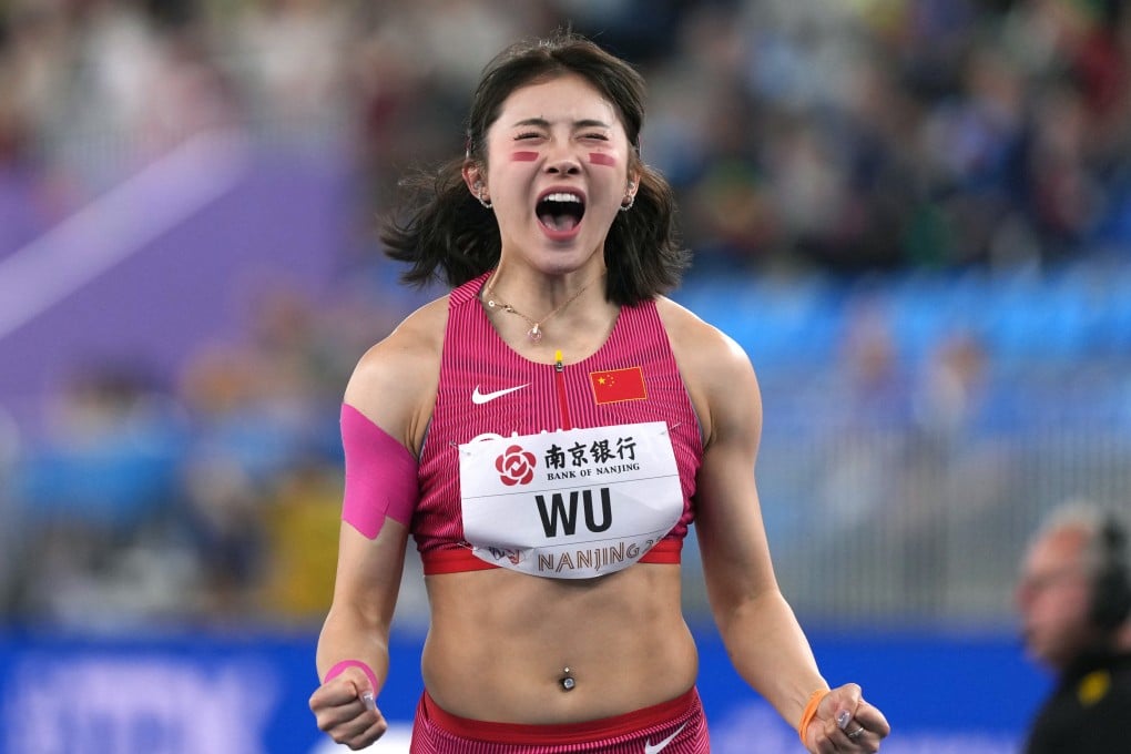Wu Yanni celebrates after breaking the national record in women’s 60m hurdles at the World Athletics Indoor Championships. Photo: Xinhua