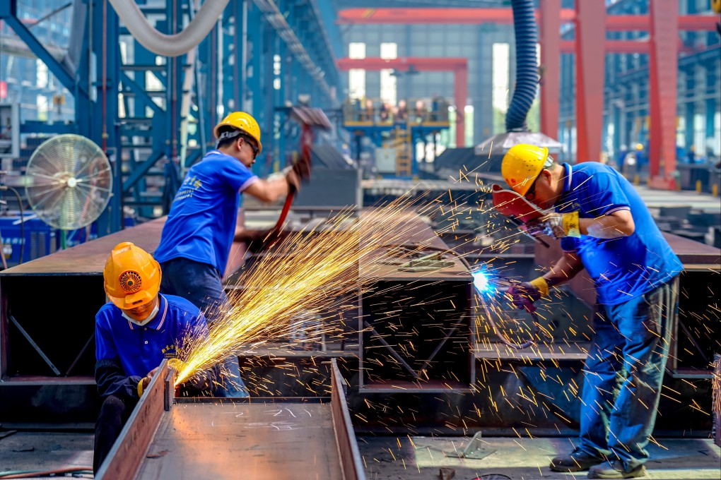 Workers weld steel structure products to meet demand for orders, in Yuncheng, Shanxi province, in 2023. Photo: VCG / Getty Images