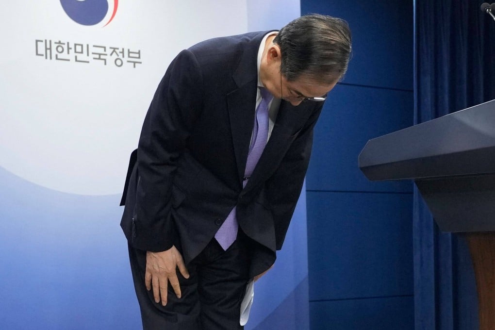 South Korea’s acting president Han Duck-soo bows during a briefing at the Government Complex in Seoul on Monday. Photo: AFP