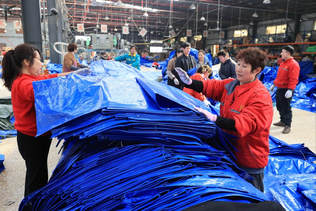Employees check woven plastic bags this month at a factory that produces plastic products for export in China’s Jiangsu province. Photo: AFP