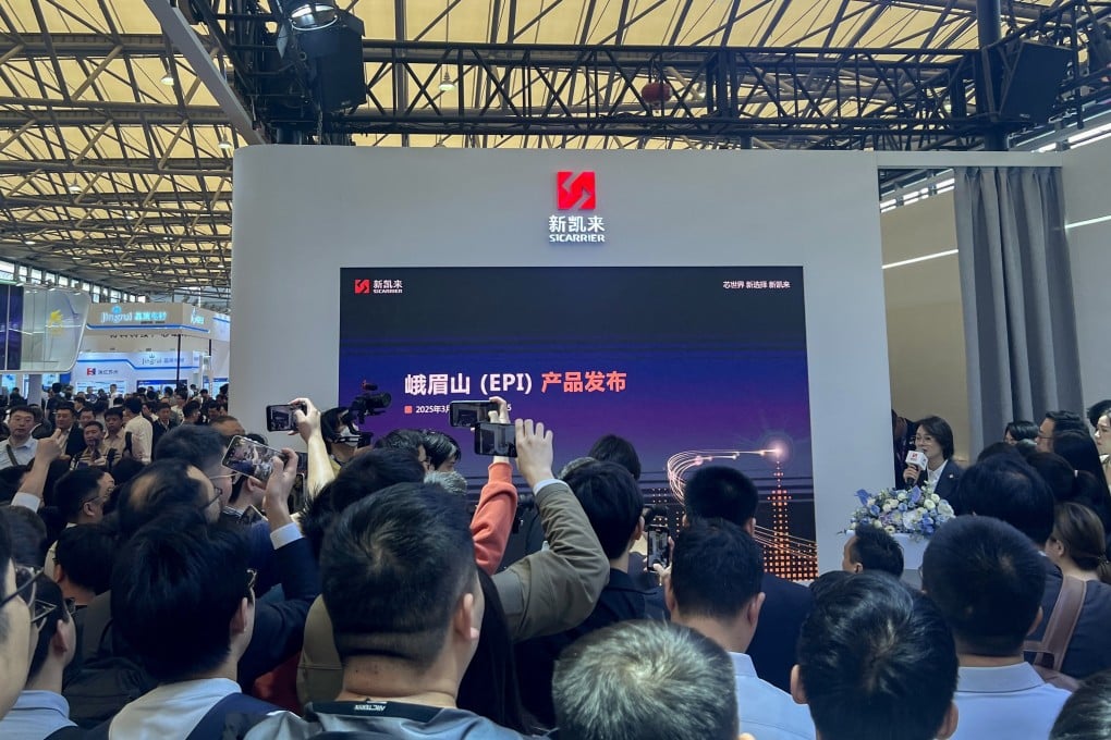 The booth of chip equipment maker SiCarrier drew large crowds at Semicon China on March 26, as people looked for any new information regarding the company’s latest technology. Photo: Ann Cao