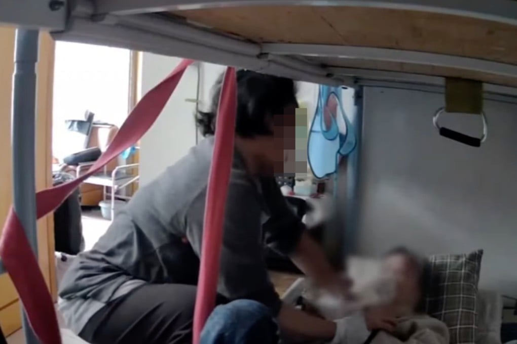 Security footage circulating online shows a domestic helper allegedly abusing a struggling 81-year-old woman. Photo: Handout