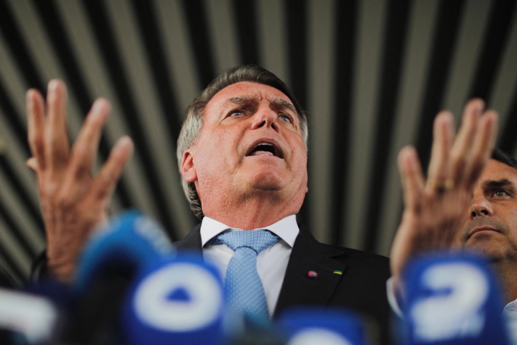 Brazil’s former president Jair Bolsonaro speaks to the media after leaving the Senate building in Brasilia on Wednesday. Photo: AFP