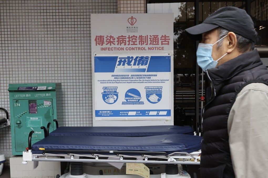 A man walks past an Infection Control Notice at Queen Elizabeth Hospital in Yau Ma Tei. Photo: Edmond So