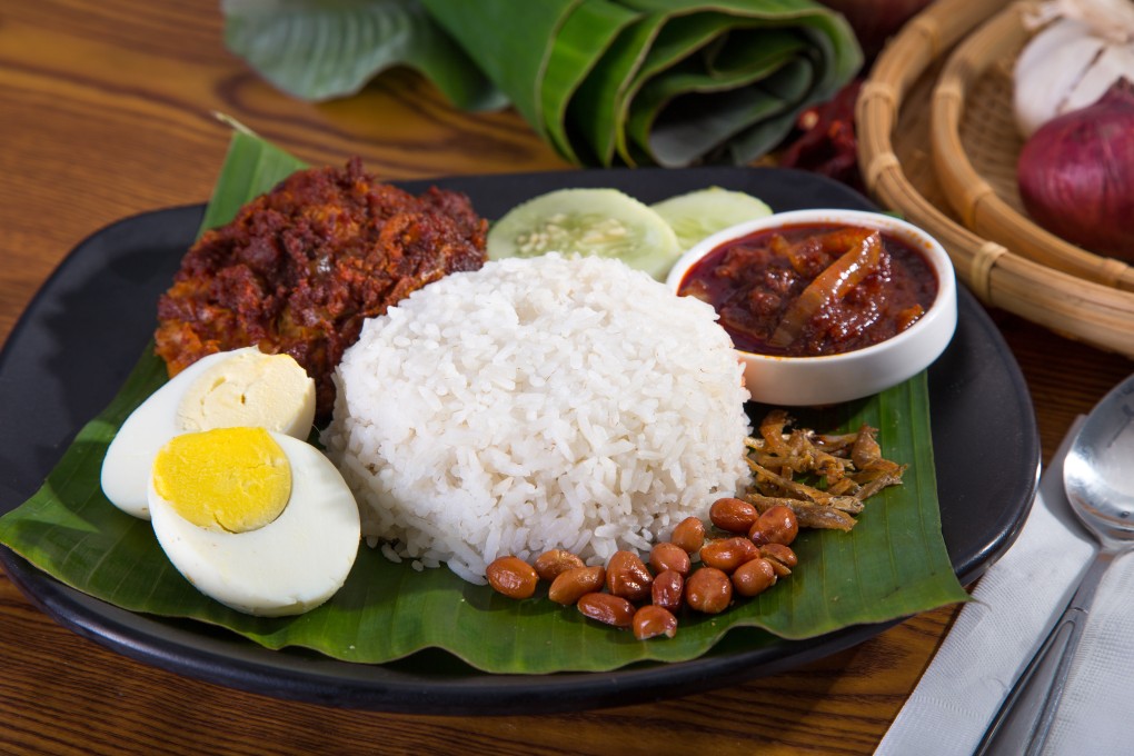 Nasi lemak, a Malay dish of rice cooked in coconut milk and flavoured with pandan leaf topped with other garnishes. Photo: Shutterstock