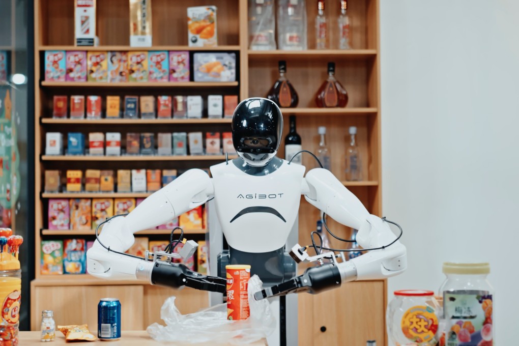 A humanoid robot made by the Chinese company AgiBot works at a supermarket checkout. US and Chinese robotics start-ups are attracting a dominant share of global venture capital investment, according to a new study. Photo: Handout