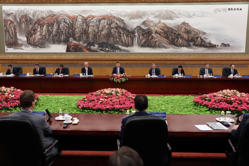 President Xi Jinping and other high-ranking government officials meet with foreign business leaders in Beijing on Friday. Photo: Reuters