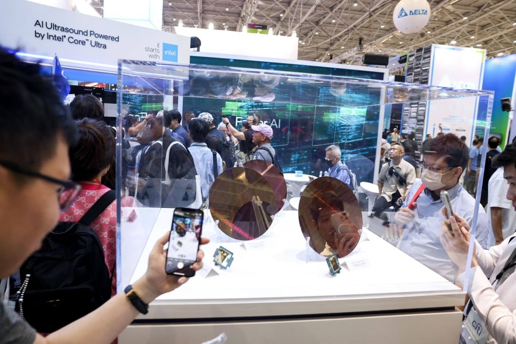 Visitors take pictures of wafer samples at the Intel booth during Computex 2024 in Taipei last summer. US President Donald Trump’s threat of tariffs on semiconductor chips has complicated Taiwan’s bid to remain a global powerhouse in the critical sector and stay onside with key backer Washington, analysts have said. Photo: AFP