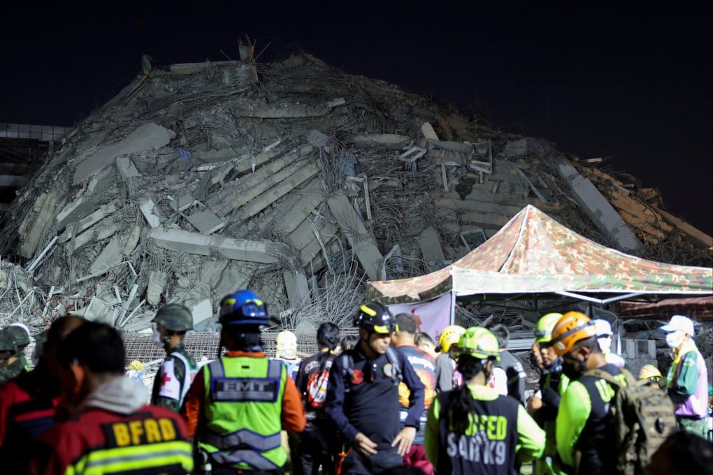 Rescue personnel near a building in Bangkok that collapsed after a strong earthquake struck central Myanmar on Friday. Photo: Reuters