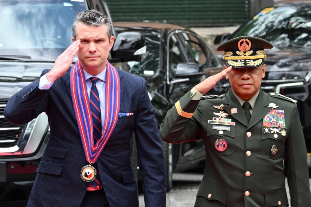 US Secretary of Defence Pete Hegseth (left) and Armed Forces of the Philippines Chief of Staff General Romeo Brawner salute on arriving at Camp Aguinaldo in Manila on Friday. Photo: AFP