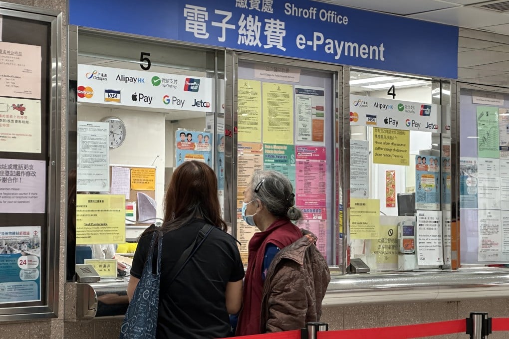 People queue at the payment counter at Queen Elizabeth Hospital in Jordan on March 25. The prices of non-critical services such as accident and emergency, general and specialist outpatient and inpatient services in public hospitals will be increased, the Health Bureau has announced, and each service and drug will be charged item by item. Photo: Jelly Tse