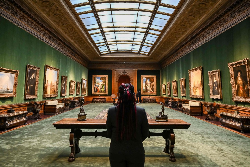 A visitor stands in The Frick Collection’s West Gallery during a press preview on March 25, 2025 in New York. The Frick Collection will reopen to the public on April 17 following a multi-year renovation and enhancement. Photo: AFP