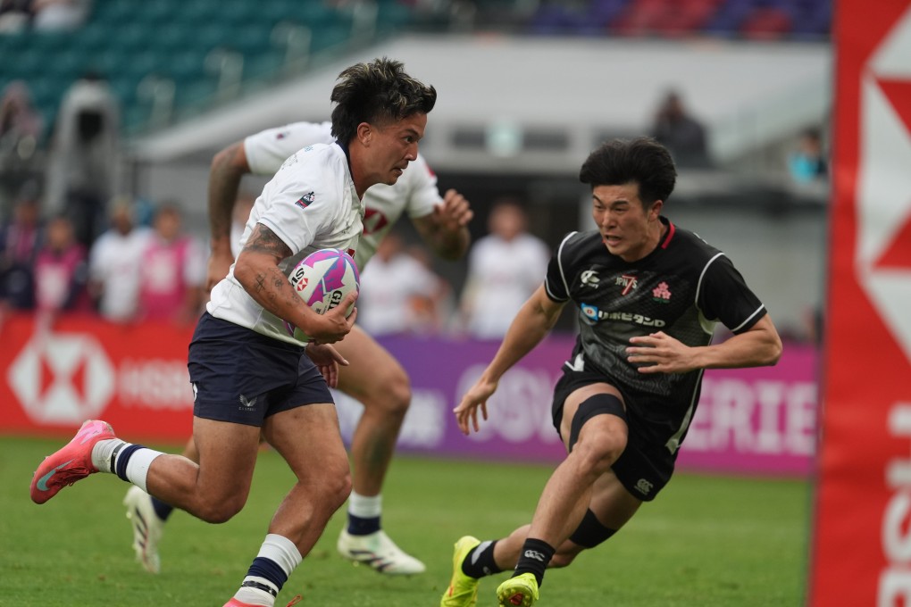 James Christie powers over to score for Hong Kong against Japan. Photo: Elson Li