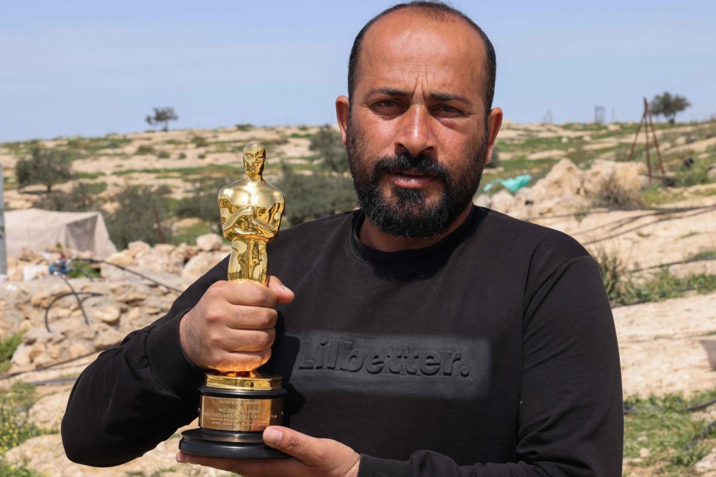 Palestinian filmmaker Hamdan Ballal with his Oscar on Wednesday. Photo: AFP
