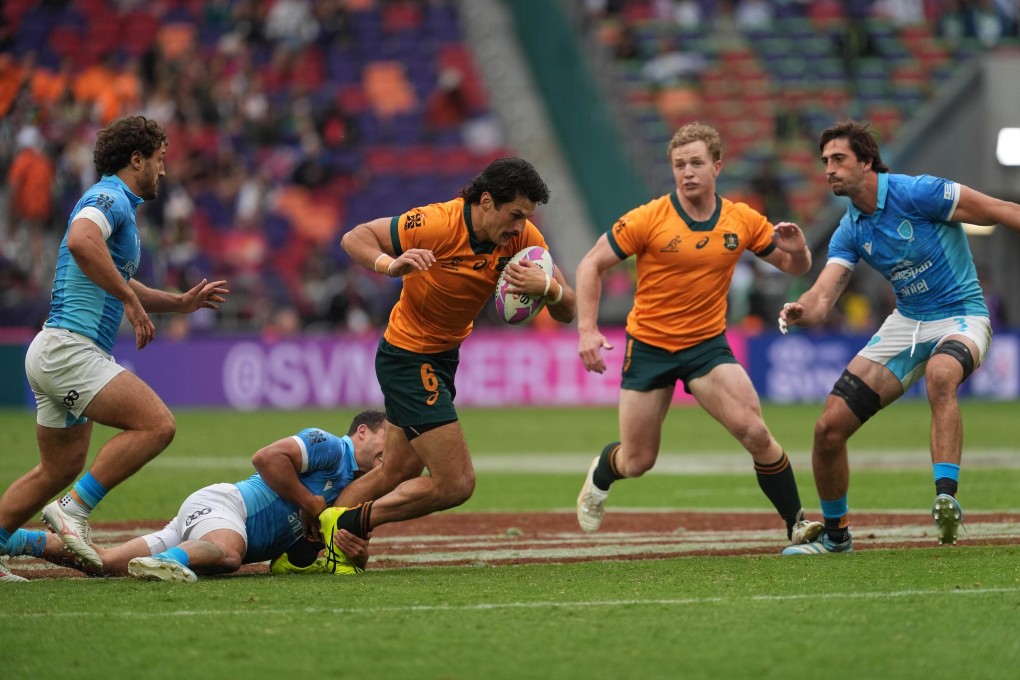 Australia captain Henry Hutchison (second from right) backing up teammate Henry Paterson in their win against Uruguay.