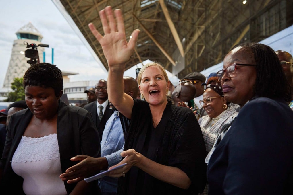 Zimbabwe’s Sports Minister Kirsty Coventry (centre) waves to crowds gathered to welcome her on her arrival back home at the Robert Mugabe International Airport after her recent appointment as International Olympic Committee president, on Sunday. Photo: AFP