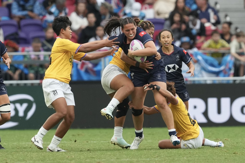 Hong Kong’s women’s team (in blue) give the home crowd something to cheer about with a 47-0 victory over Thailand. Photo: Sam Tsang