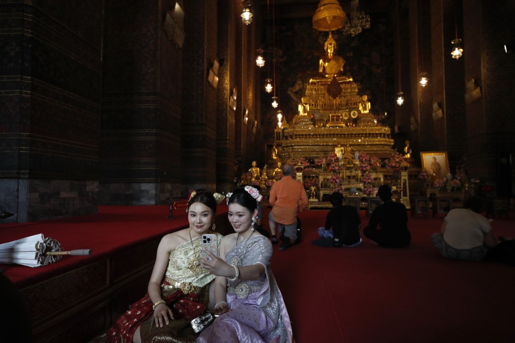 Tourists visit the Wat Pho temple in Bangkok on March 19. Photo: EPA-EFE