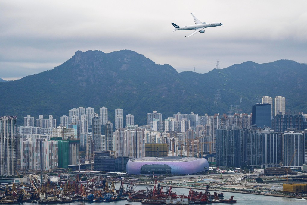The Airbus A350 plane performs a low-altitude fly-past over Victoria Harbour as part of celebrations for the100th anniversary of the old Kai Tak Airport, now the site of Kai Tak Sports Park. Photo: Eugene Lee