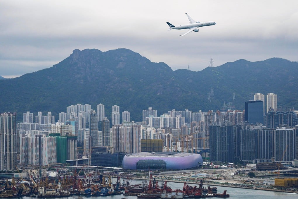 The Airbus A350 plane performs a low-altitude fly-past over Victoria Harbour as part of celebrations for the100th anniversary of the old Kai Tak Airport, now the site of Kai Tak Sports Park. Photo: Eugene Lee