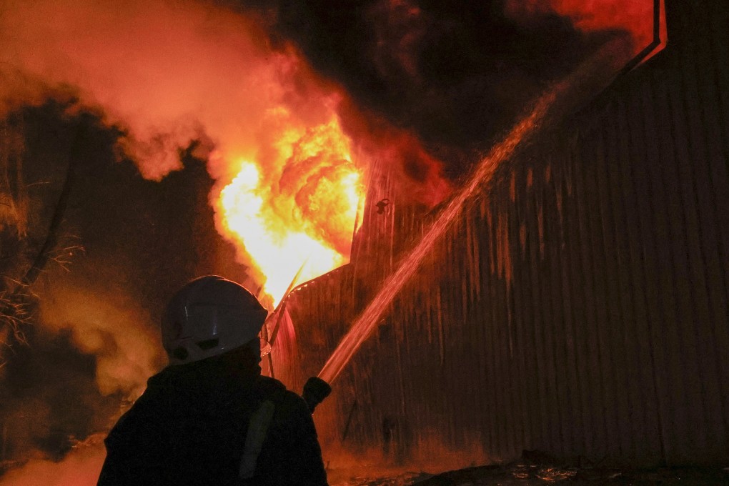 Ukrainian rescuers work to extinguish a fire at the site of a drone strike in Kharkiv. Photo: EPA-EFE