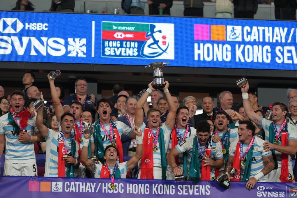 Argentina captain Santiago Mare hoists the trophy aloft after his jubilant team’s brutal win over France at Kai Tak Stadium. Photo: Sam Tsang