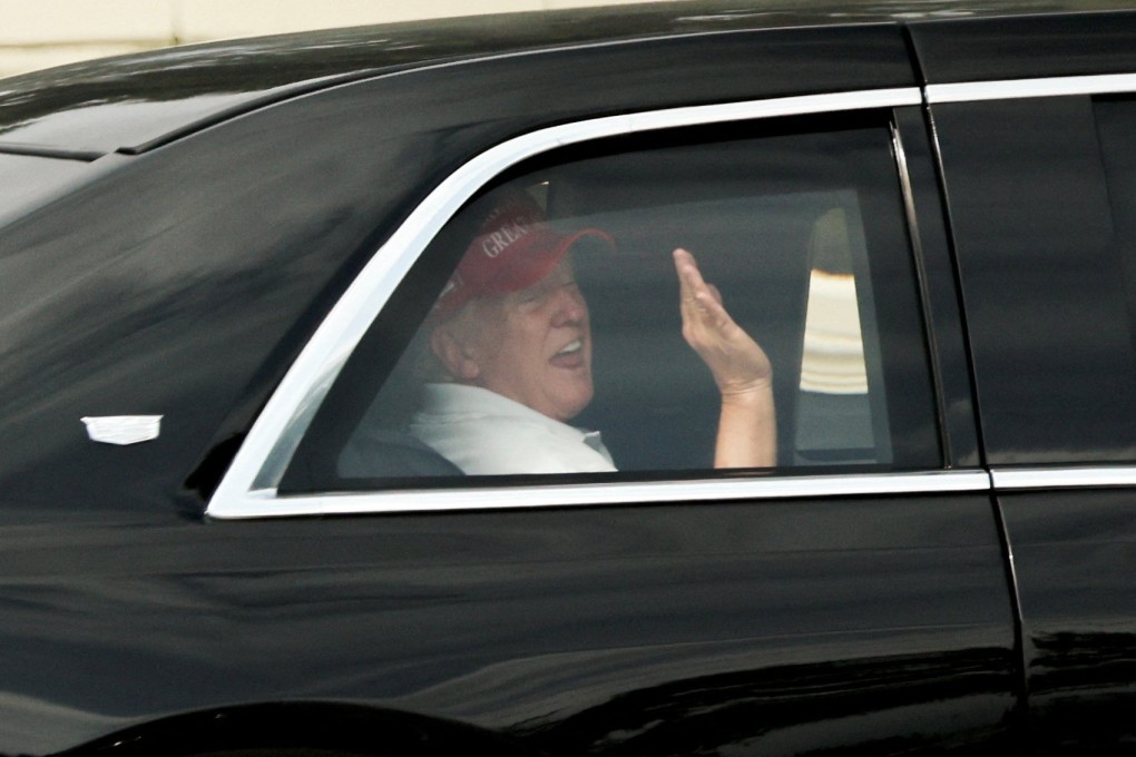 US President Donald Trump waves to supporters as he departs his golf course in Florida on March 29. Photo: Reuters