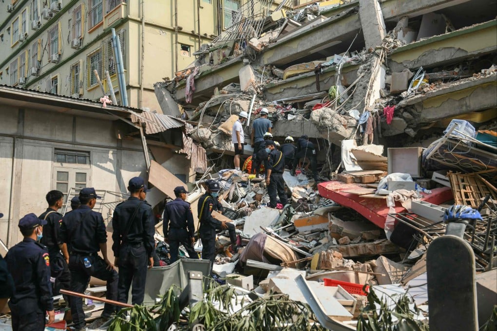 Rescuers work to save residents trapped under the rubble of a destroyed condominium in Myanmar’s Mandalay on March 29. Photo: AFP