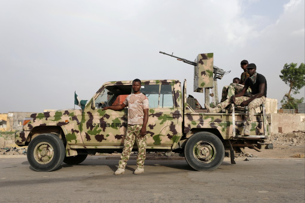 Nigerian soldiers during a patrol at the Banki IDP camp in Borno, Nigeria, April 26, 2017. Photo: Reuters
