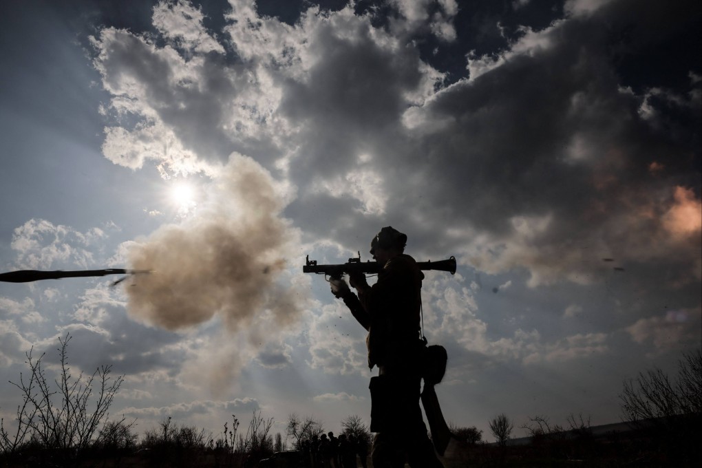 A Ukrainian serviceman fires a weapon during training. Photo: 24th Mechanized Brigade of Ukrainian Armed Forces via AFP