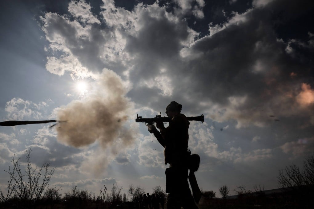 A Ukrainian serviceman fires a weapon during training. Photo: 24th Mechanized Brigade of Ukrainian Armed Forces via AFP