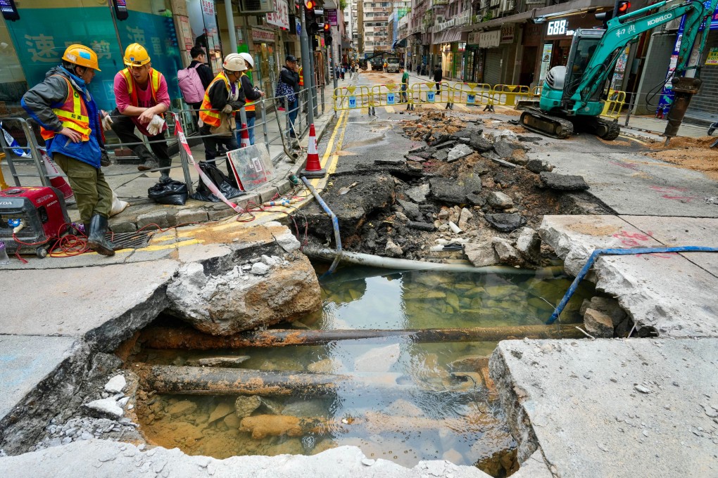 Workers make emergency repairs in North Point. Photo: Sam Tsang