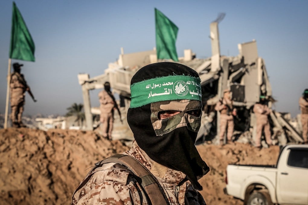 Fighters of the Islamic Jihad and Ezz al-Din Al-Qassam brigades, the military wing of Hamas, during the handover of three Israeli hostages in February. File photo: Abed Rahim Khatib/dpa