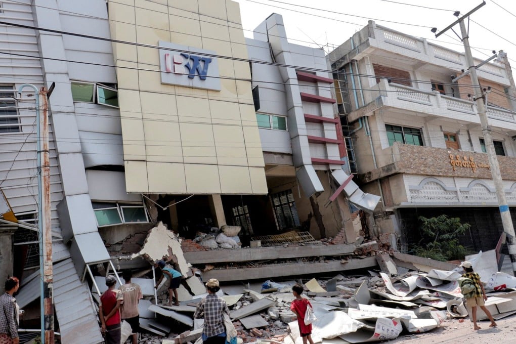 People inspect the site of a damaged building in the aftermath of a 7-7-magnitude earthquake, in Mandalay, Myanmar, on Monday. Photo: Reuters