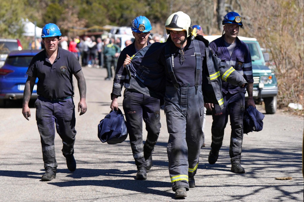 Miners exit the premises after an accident that left five miners dead at the Cerredo coal mine in Degana, Asturias, Spain on Monday. Photo: AFP