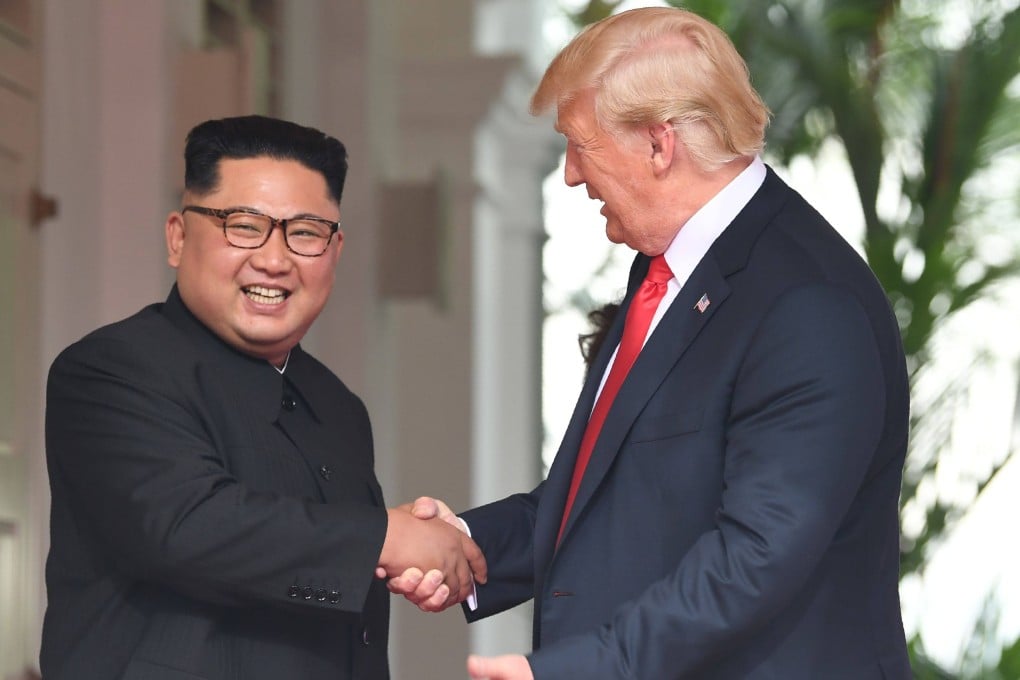 North Korean leader Kim Jong-un shakes hands with US President Donald Trump at the start of their summit in Singapore in June 2018. Photo: AFP