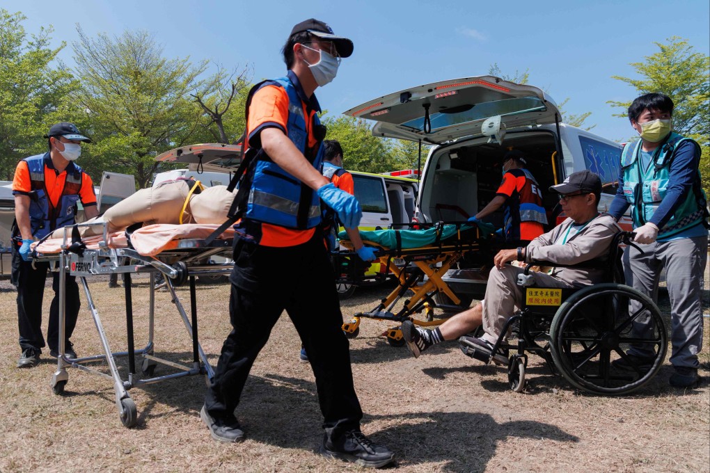 People took part in a “defence resilience drill” in Tainan on Thursday, which tested evacuation protocols and temporary shelter facilities for displaced residents. Photo: AFP