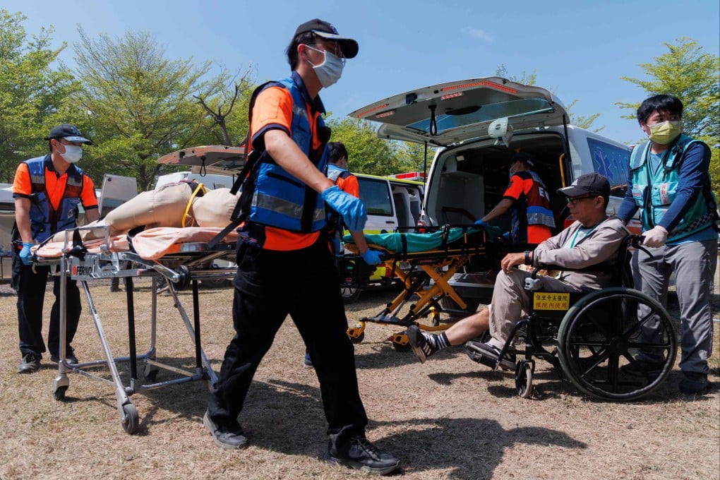 People took part in a “defence resilience drill” in Tainan on Thursday, which tested evacuation protocols and temporary shelter facilities for displaced residents. Photo: AFP