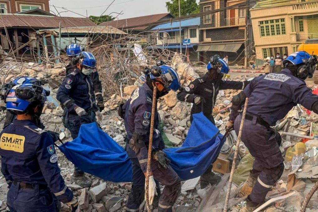 Members of the Special Malaysia Disaster Assistance and Rescue Team retrieve bodies from under collapsed buildings in Sagaing, Myanmar, on Monday. Photo: Facebook/Smart Team Malaysia