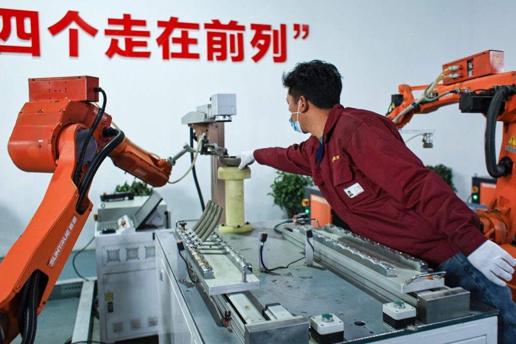 A worker checks a pan at a cookware factory during a Chinese government-organised media tour last week in Lhasa, Tibet autonomous region. China’s factory activity sped up in March. Photo: EPA-EFE