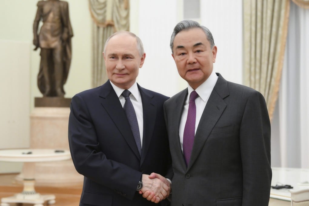 Russian President Vladimir Putin with Chinese Foreign Minister Wang Yi at the Kremlin, in Moscow on April 1. Photo: AP