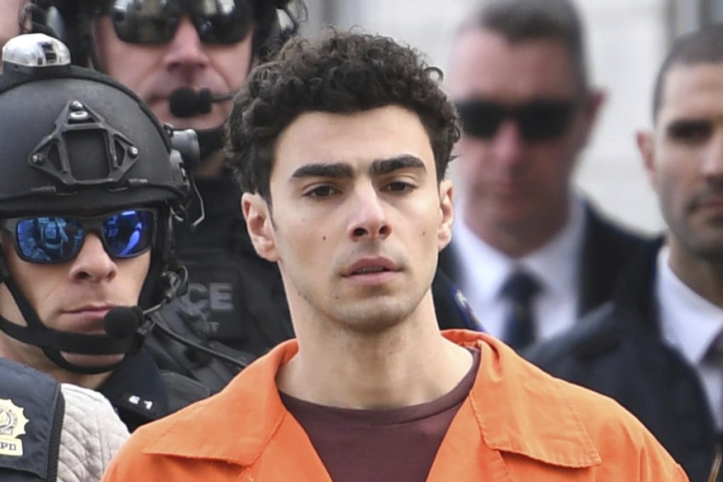 Luigi Mangione, a suspect in the fatal shooting of UnitedHealthcare CEO Brian Thompson, is escorted by police on December 19, 2024, in New York. Photo: AP