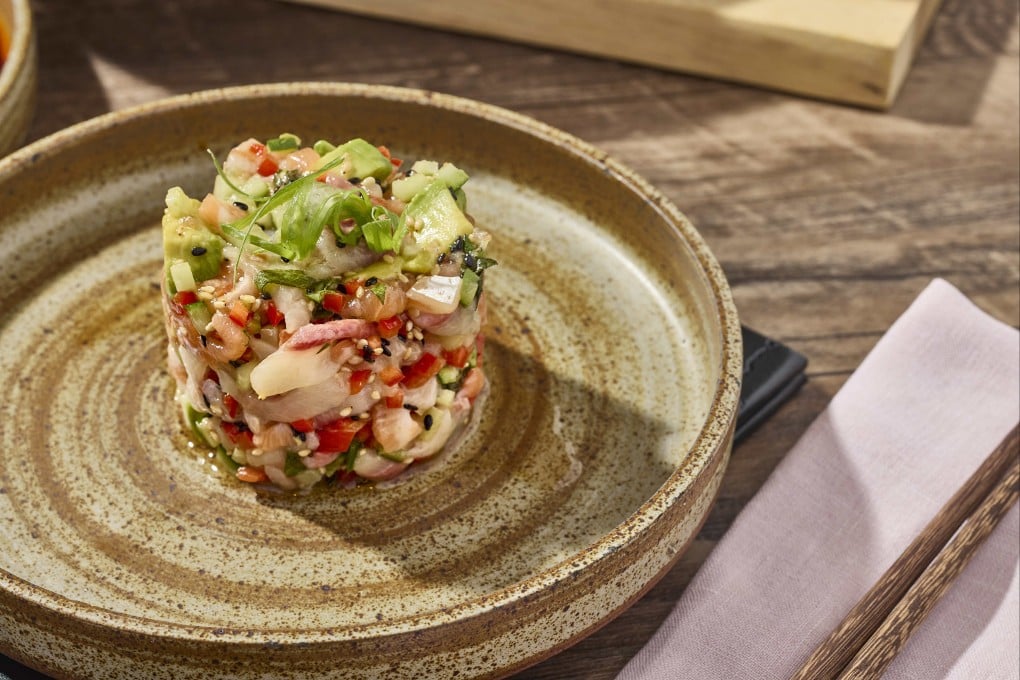 Uma Nota’s trio tartare of prawns, salmon and hamachi with yuzu kosho and gyoza chips. Photo: Handout