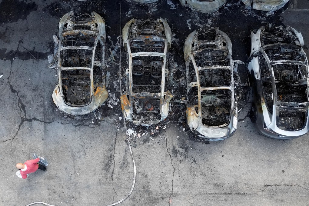 Charred Tesla vehicles at a Tesla dealership in Rome. Photo: Reuters