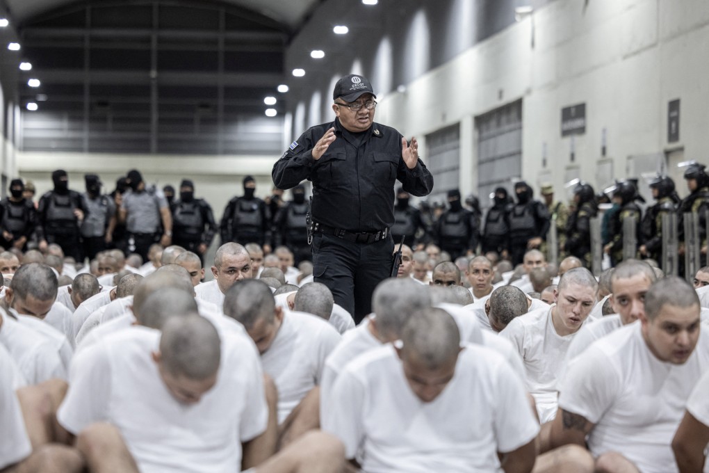 Alleged Venezuelan gang members deported by the US sit on the floor before they are imprisoned in the Terrorism Confinement Centre in Tecoluca, El Salvador, in footage obtained in March. Photo: Secretaria de Prensa de la Presidencia via Reuters